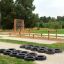 Tires (10 pcs) uspořádané na venkovní hřištní dráze.